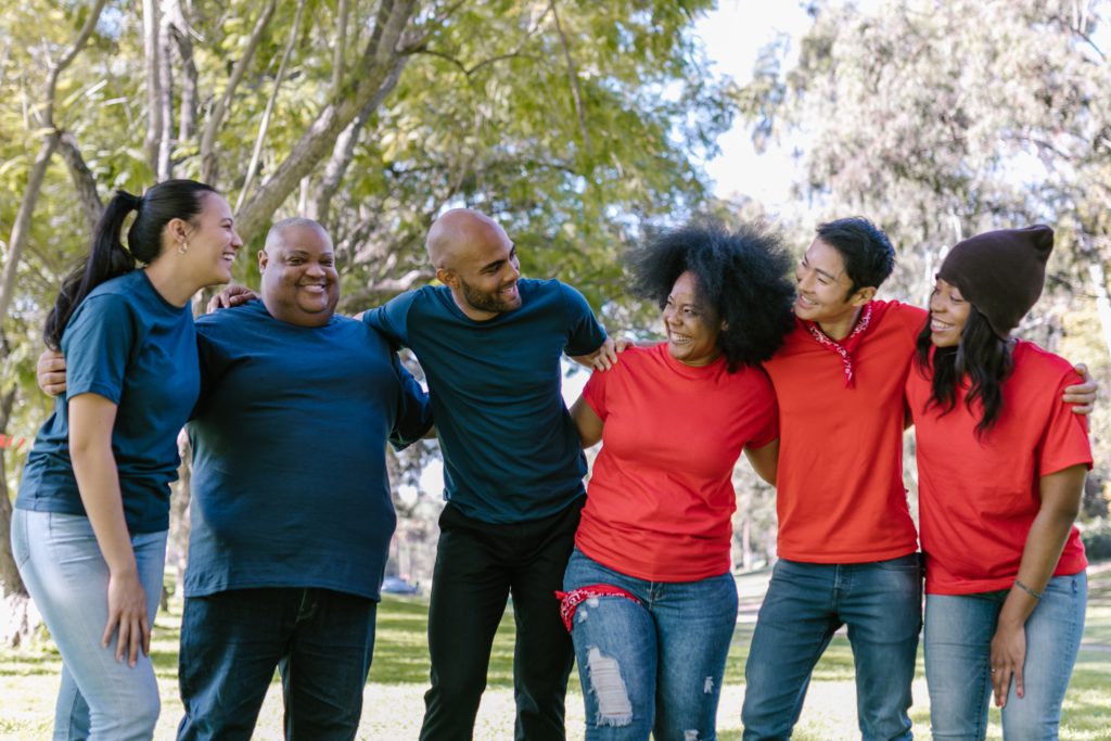 5 team members in a group laughing